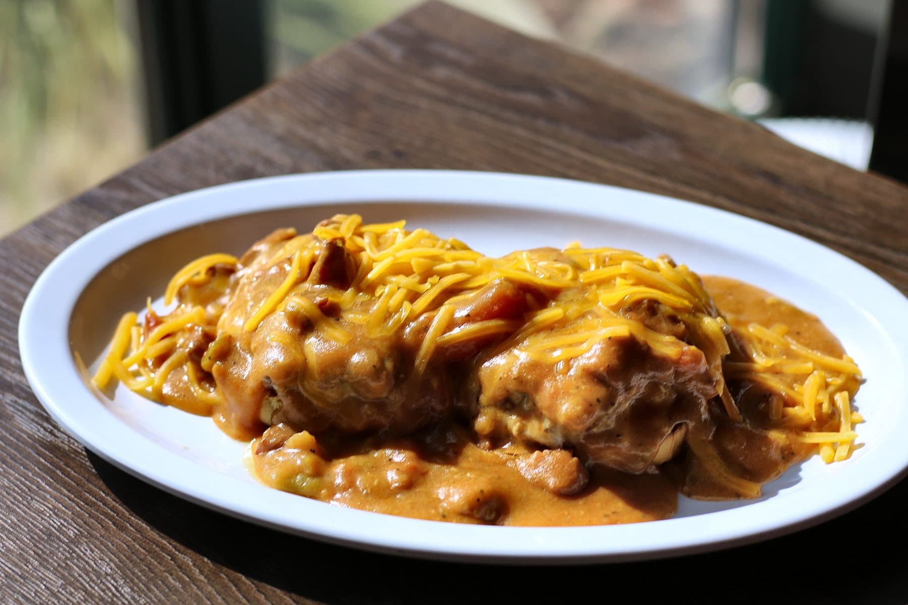 The Slopper, an open-faced burger smothered in green chili and cheddar